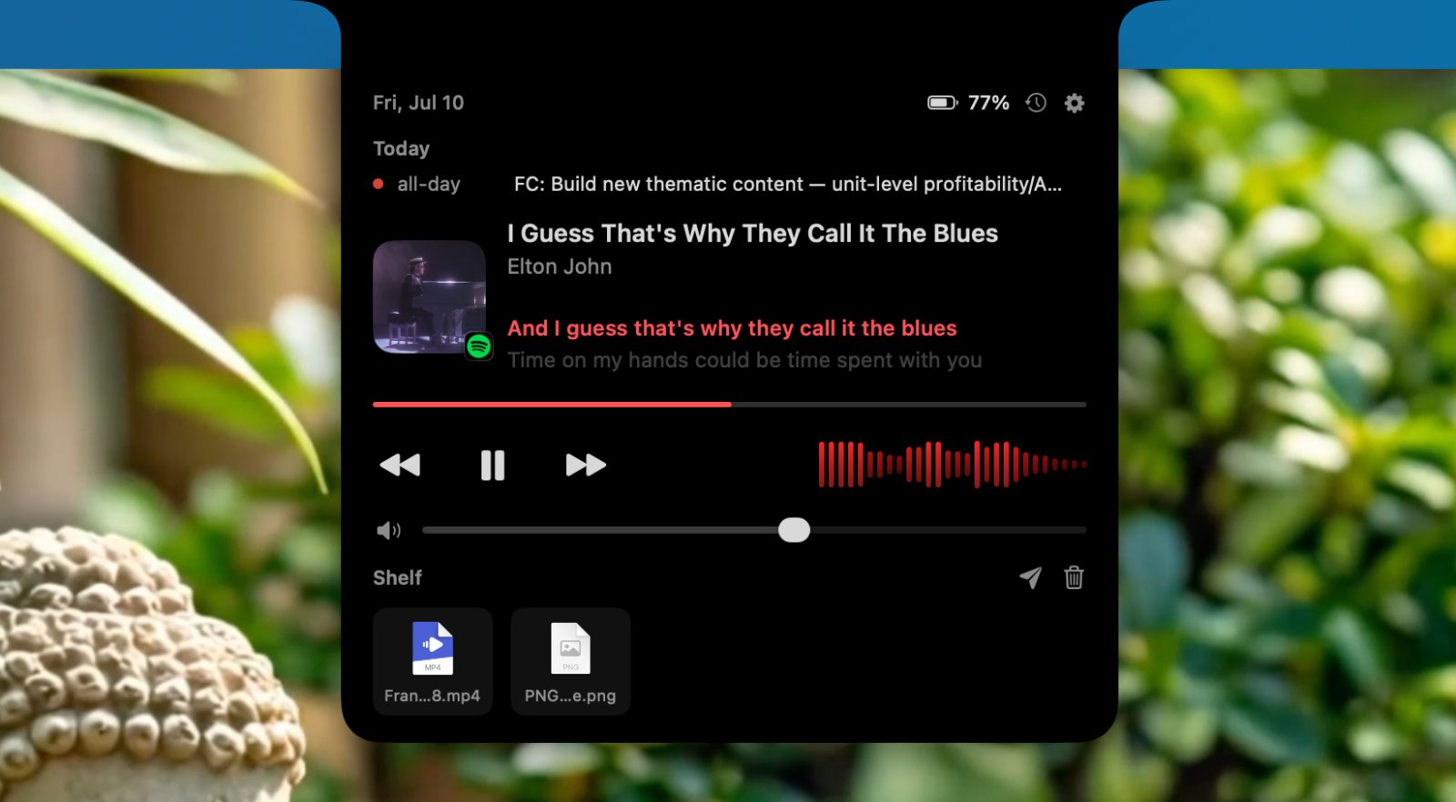 Now-playing media controls in the Marqee notch